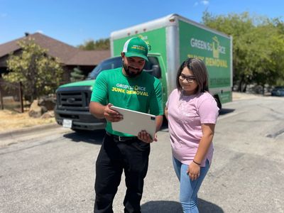 Green Source Junk Removal employee with customer in Fort Worth