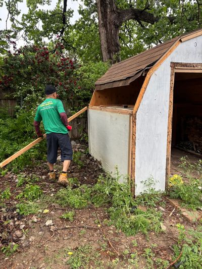 Green Source Junk Removal removing debris from a shed in Arlington, TX