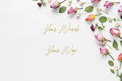 Dried roses and leaves with inspirational text on white background.