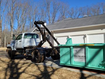 Truck Delivering two dumpsters to one location