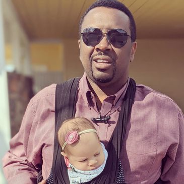 Music producer with baby.