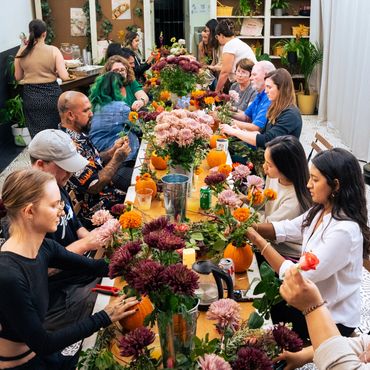 People making flower arrangements