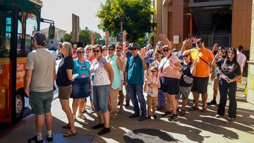 People waiting for the Trolley at the Taste of College Area event
