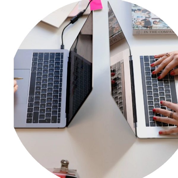 Two people working on their laptops