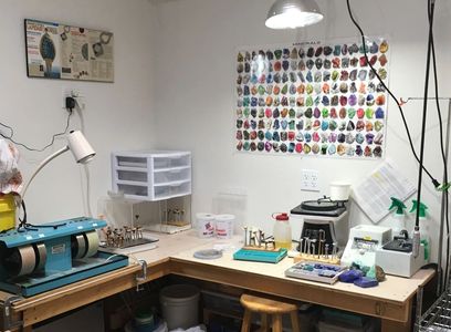 The lapidary or stone cutting area inside the studio.