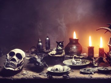 A spooky altar with skulls, candles, and mysterious objects emitting smoke.