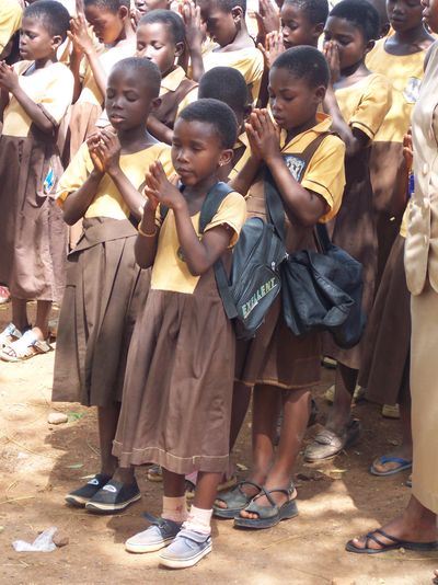 Children praying in Dodowa Ghana Sunshine After Rain Ministries