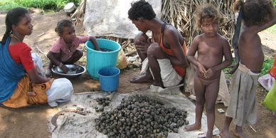 Family working on gathering food for the evening Sunshine After Rain Ministries India