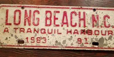 Old Long Beach NC license plate, which is a Tranquil Harbour.