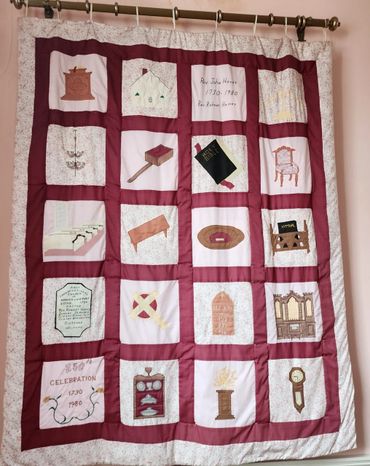 A handmade quilt with 20 different memories sewn in
