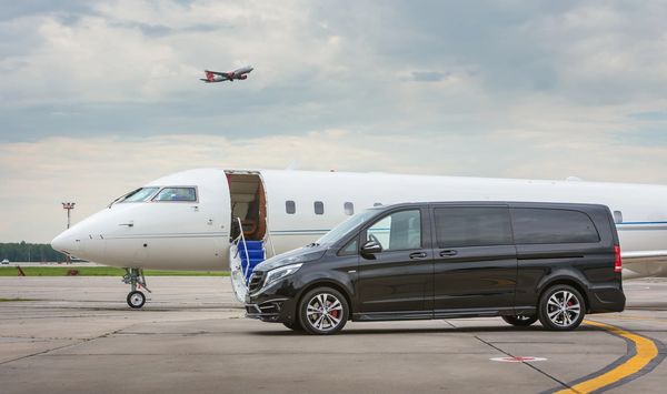 Private busines Jet airplane with Mercedes Benz V-class luxury car