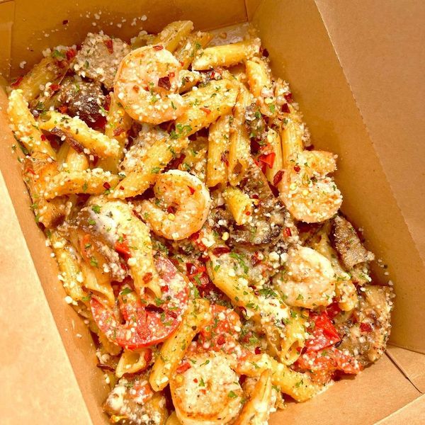 garlic parmesan pasta with shrimp and chicken breast fresh tomatoes extra cheese delicious italian