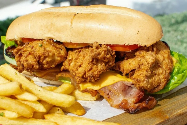 top club panini sandwich fried chicken, bacon lettuce tomato mayo and french fries combo