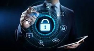 Businessman interacting with digital security icons on a virtual screen.