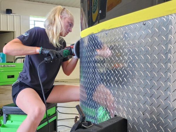 Detailer, Summer, polishing diamond plat back to a mirror finish on the front end of a trailer