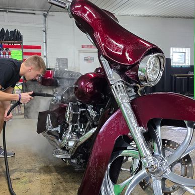 Steam cleaning a classic full dresser Harley Davidson from Full Throttle Ink in Sheboygan Falls, WI.