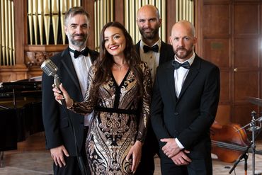 Jazz quartet with vocals, drums, piano and bass