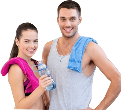A woman and a man dressed in gym clothes smiling at the camera