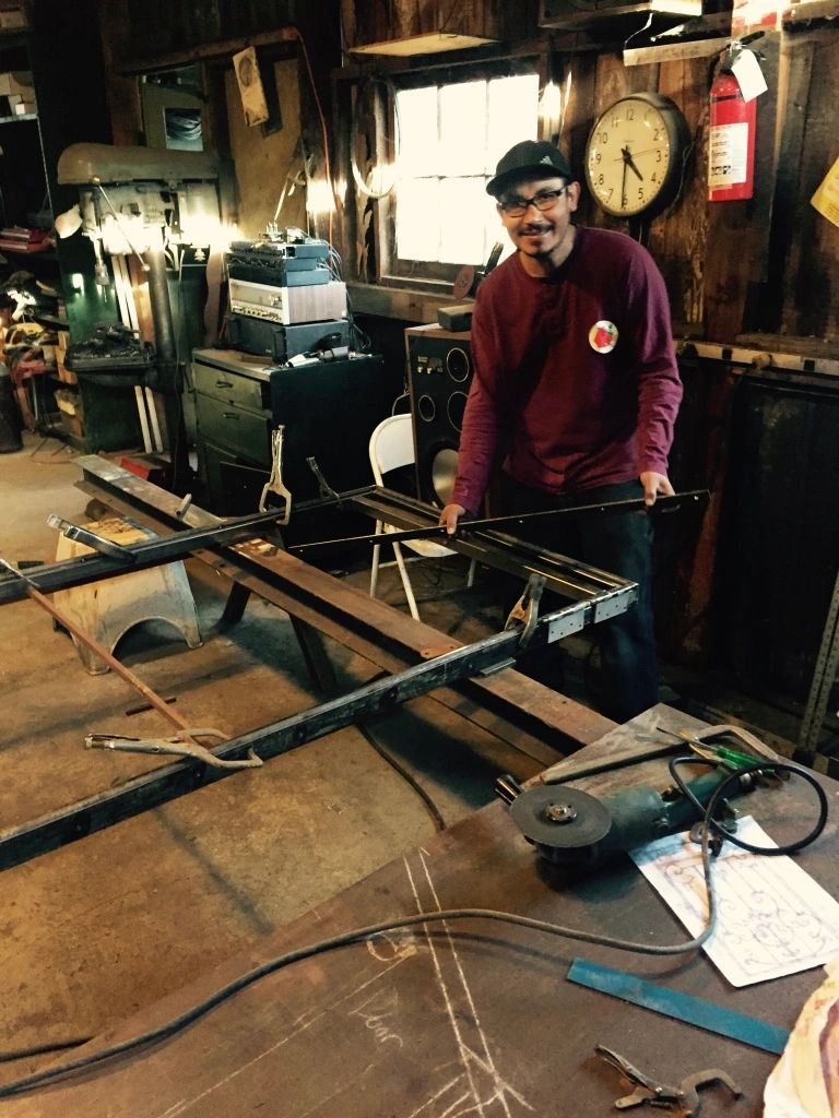 Carlos in his area getting ready to weld up a frame.