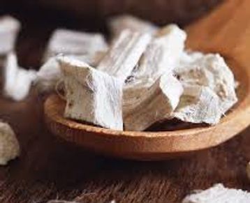 Marshmallow root chunks in a wooden spoon. Used for our tea and powdered for our capsules