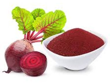 Organic Beet root powdered in a bowl with raw beets nxt to bowl. Used to make our capsules