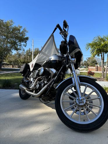 Unfurl comfort, sleek chrome shines. Custom Cruiser Canopy: Where luxury & freedom entwine.