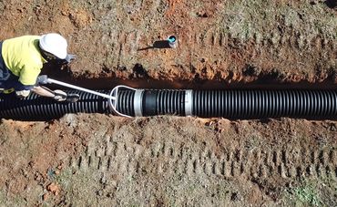 Pipe sections connected in trench