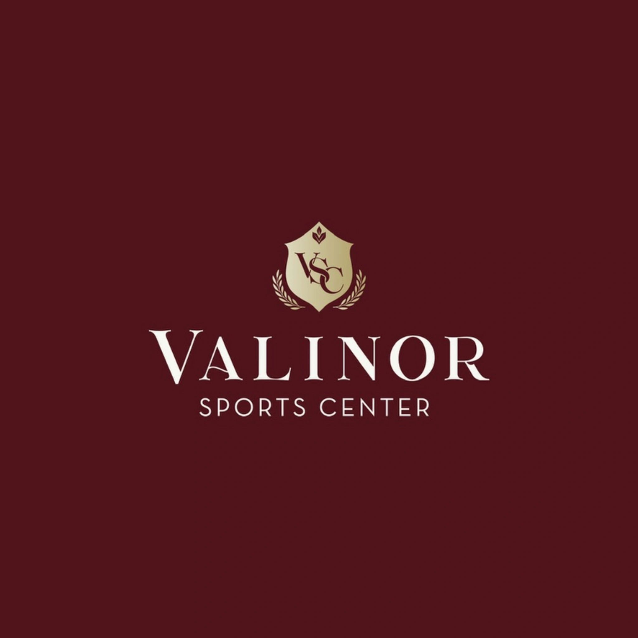 Elegant logo for Valinor Sports Center with gold and white text on maroon background.
