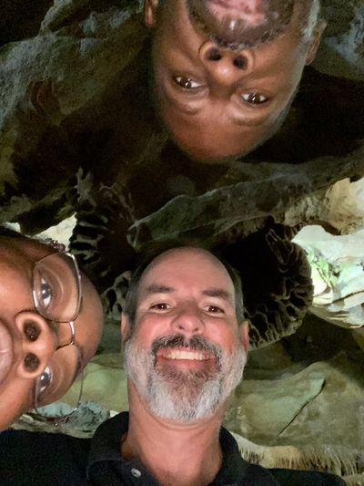 Steve, the CEO, and friends within the I/DD Waiver Program on a trip to view caves.