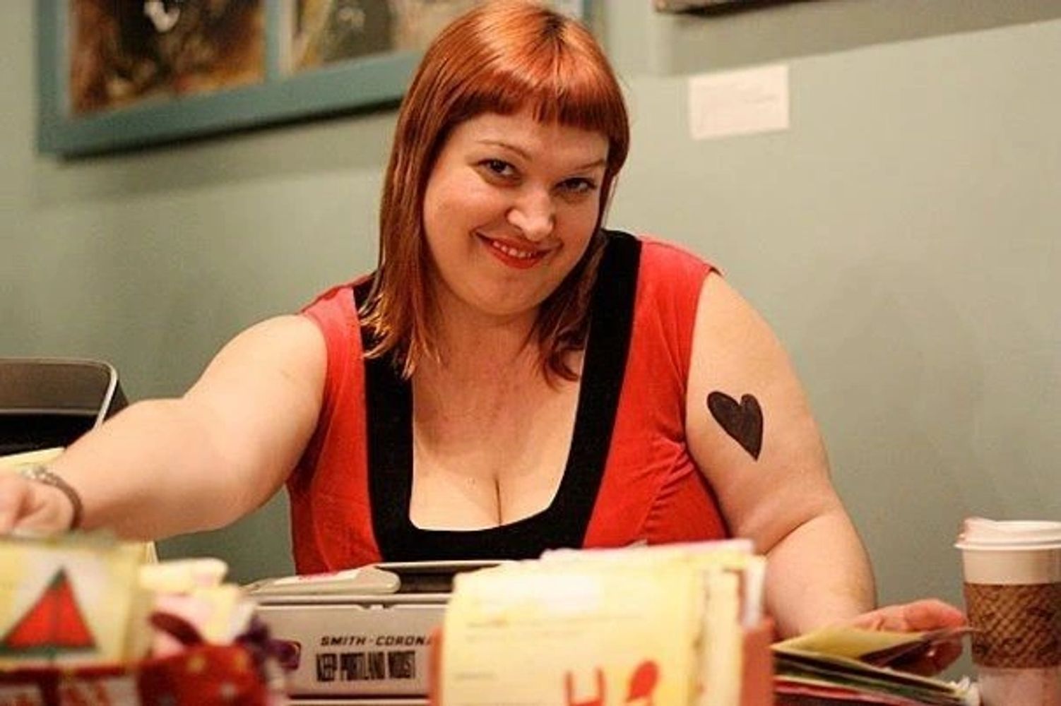 Alisa Starr typing her Snarky Cards on her trusty typewriter.