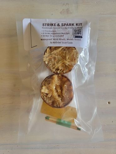 Vacuum-sealed Strike & Spark kit with Matches + Striker strip and QR code label.
