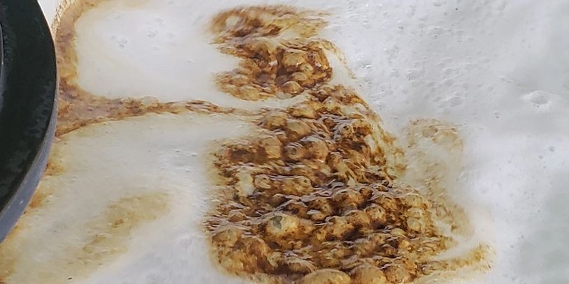 Scum and scale in a dirty hot tub