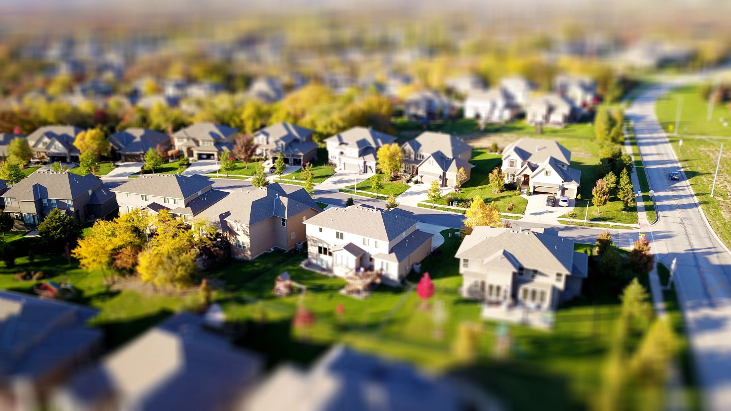 Aerial view of a suburban neighborhood with houses and streets.