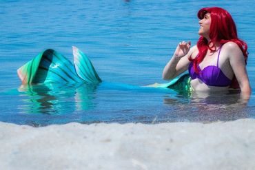 Mermaid Ariel going for a swim at the beach