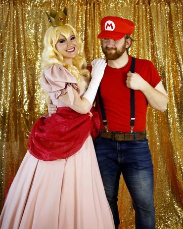 Princess Peach and Mario posing for a picture