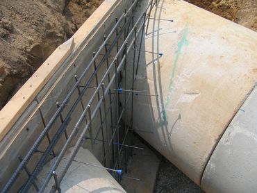 reinforcement for ring beam in a drainage system