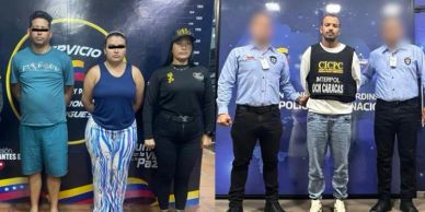 Police officers standing with detained individuals against a backdrop of law enforcement logos.