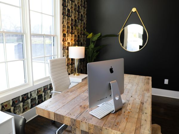 Computer on desk in an office.