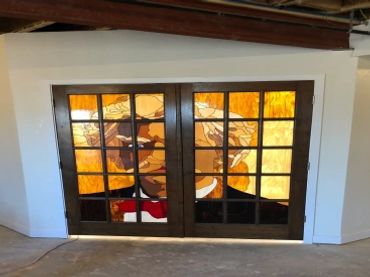 Custom stained glass panes in wood door