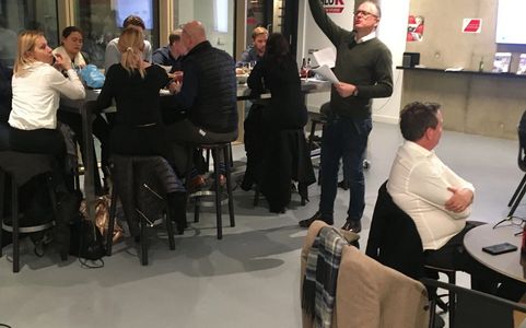 Man explaining rules of quiz