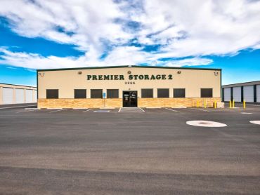 Exterior of Premier Storage 2 building with clear sky.