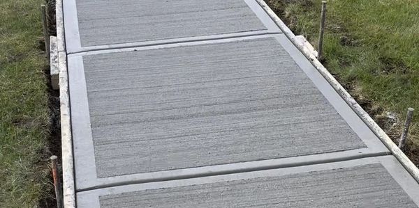 For a concrete sidewalk, a broom finish is a classic, cost-effective, and safe option!