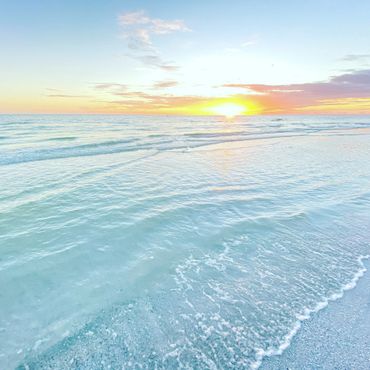 Siesta beach sunset. Golden sunset with aqua blue water and pure white sand!