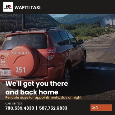 Wapiti Taxi car ready for reliable rides in mountainous area.