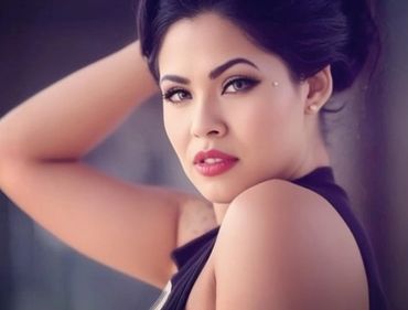 Close-up portrait of a woman with elegant makeup and a confident gaze.