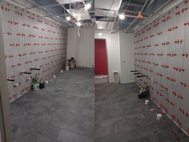 Commercial Office Bathrooms with matching tile baseboard