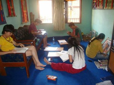 Chinese students practicing sketching as a part of Thangka painting.