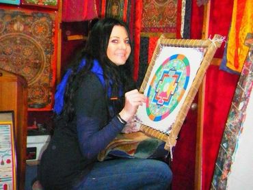 A German student painting a Mandala at the gallery in Thamel.