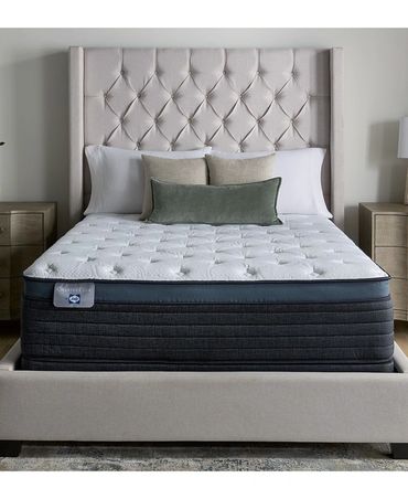 Elegant bedroom with tufted headboard and matching nightstands.