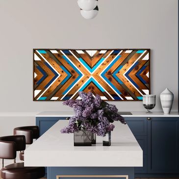 Large geometric wood wall art in modern kitchen with blues, white and wood tones.